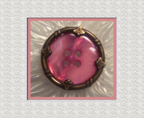 Vintage Pink Plastic Button in Brass Rim
